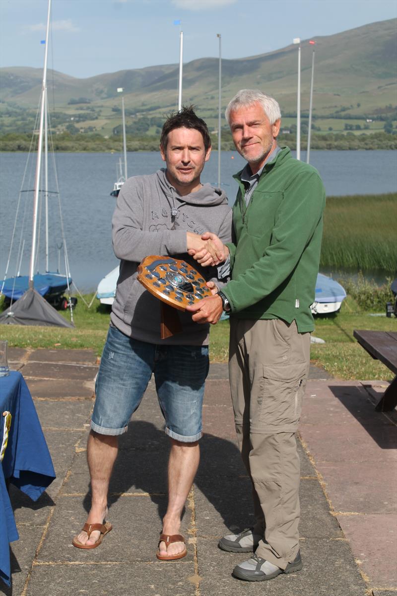 Dave Lawson is presented with the trophy by Commodore Robin Dawson after winning the Bassenthwaite Laser Open photo copyright William Carruthers taken at Bassenthwaite Sailing Club and featuring the ILCA 7 class