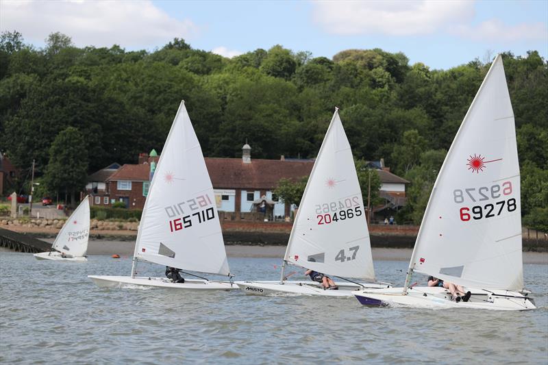 Daniel Pearson cannily hugs the shoreline while Sam Dyer, Alex Head and Henry Townsend blast up the centre during the KSSA Mid-Summer Regatta 2019 at Medway YC photo copyright Jon Bentman taken at Medway Yacht Club and featuring the ILCA 7 class