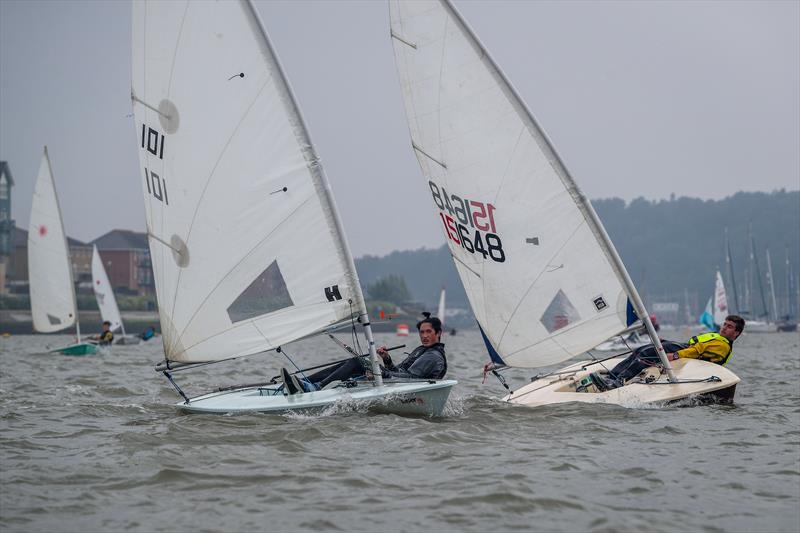 An American civil war breaks out as Sevenoaks School's Mac Raymond (101) puts the squeeze on Yiannis Scotiniadis during the KSSA Mid-Summer Regatta at Medway photo copyright Jon Bentman taken at Medway Yacht Club and featuring the ILCA 7 class
