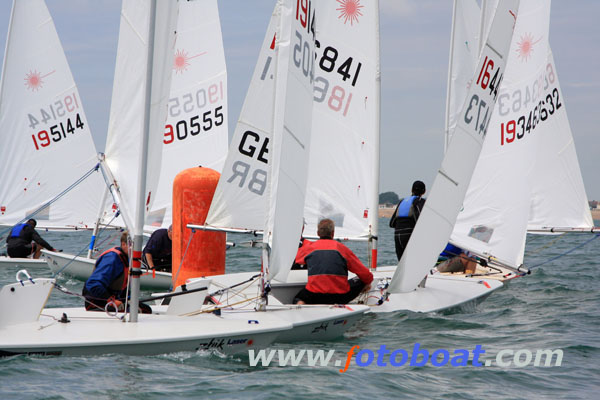 Action from the Laser Masters Nationals on Pevensey Bay photo copyright Clare Turnbull / www.fotoboat.com taken at Pevensey Bay Sailing Club and featuring the ILCA 7 class