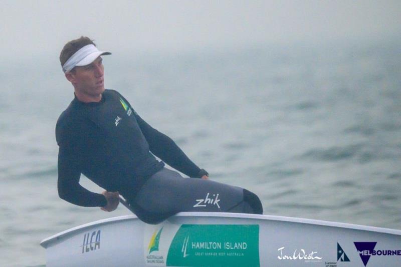 Luke Elliott (AUS) shrouded in smoke on his way to a win in Race 6 of the Australian Laser Championships. - photo © Jon West Photography