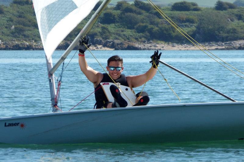 Rhys Williams demonstrating an unusual technique in his ILCA 7 during Kippford Week 2022 photo copyright Becky Davison taken at Solway Yacht Club and featuring the ILCA 7 class