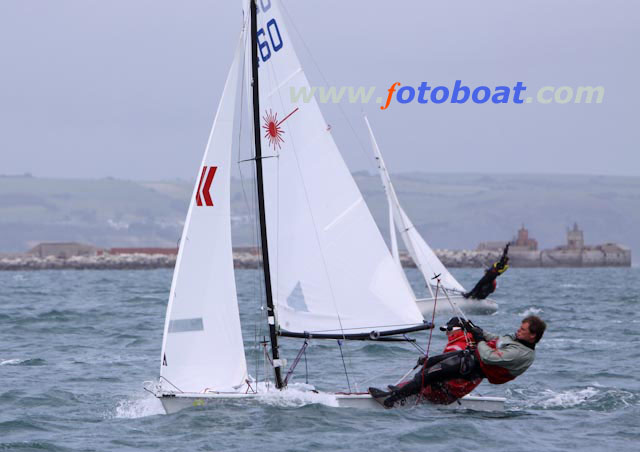 Another windy day at the Laser 2 worlds in Weymouth photo copyright Steve Bell / www.fotoboat.com taken at Weymouth & Portland Sailing Academy and featuring the Laser 2 class