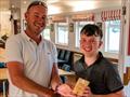 Youth Fleet member Solomon Day receives the 3rd Laser Fleet trophy from Vice Commodore Roo Jarvis - Solo and Laser Open Meeting at Middle Nene © David Livingstone