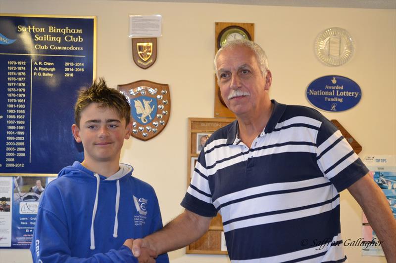 Arther Farley congratulated by Commodore Phil Bailey on winning the Laser 4.7s photo copyright Saffron Gallagher taken at Sutton Bingham Sailing Club and featuring the ILCA 4 class