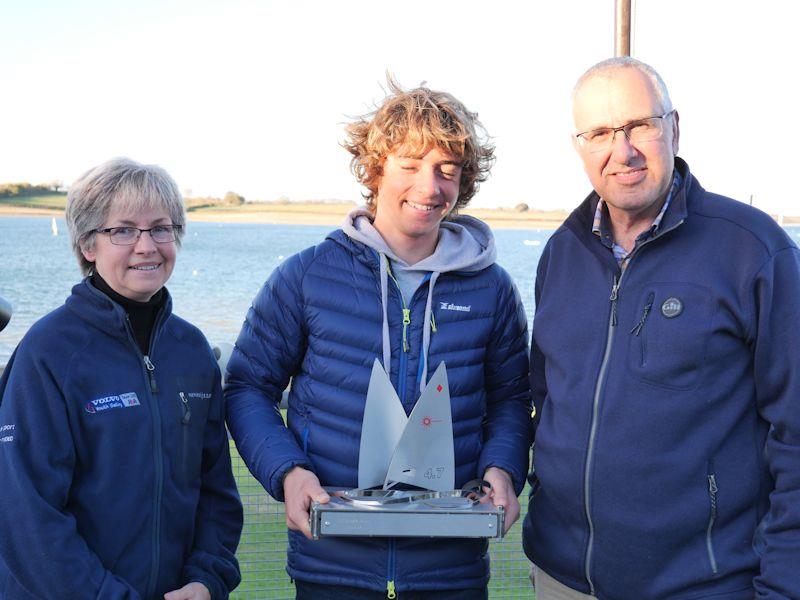 Nigel and Paula Burt with the winner of the Olivia Burt Trophy, Finley Dickinson photo copyright Paul Williamson taken at Rutland Sailing Club and featuring the ILCA 4 class