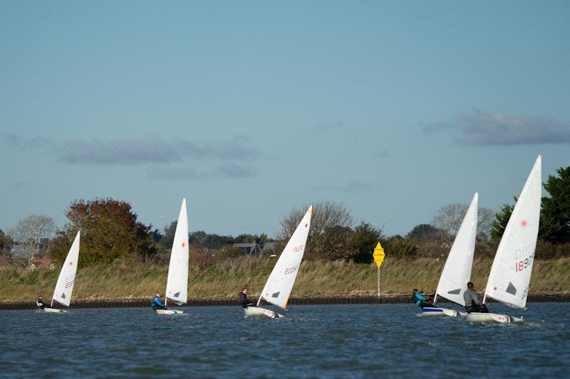 Corinthian Otters chasing the club's Commodore - first races of the RCYC Snow Globe photo copyright Petru Balau Sports Photography / sports.hub47.com taken at Royal Corinthian Yacht Club, Burnham and featuring the ILCA 4 class