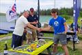 Winners collecting prizes - North ILCA UK circuit event at Pennine SC