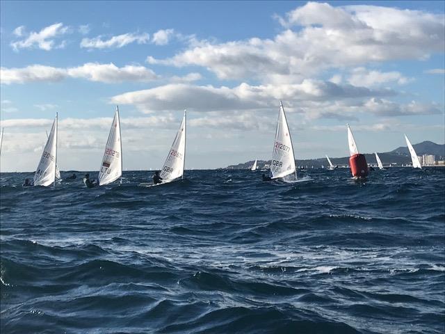 Arthur Fry close to the lead at the windward mark in choppy conditions during the Palamos Christmas Regatta photo copyright Alan Williams taken at Club de Vela Palamos and featuring the ILCA 6 class