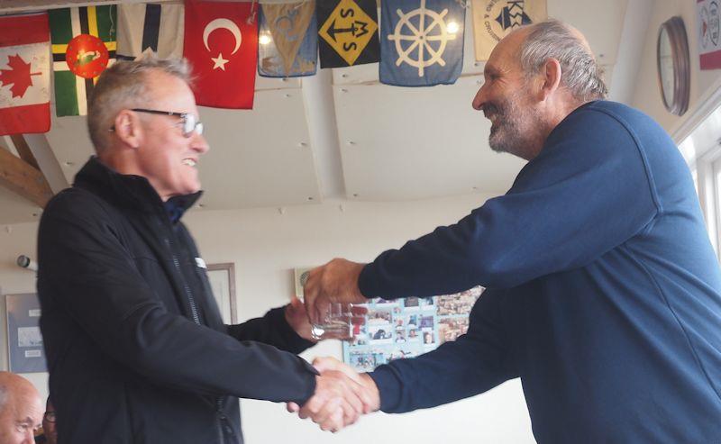 Centenary Regatta at Lyme Regis - Commodore and Race Officer Rob Wiscombe congratulates the Championship of the Day winner Graham Cook photo copyright David Beer taken at Lyme Regis Sailing Club and featuring the ILCA 6 class