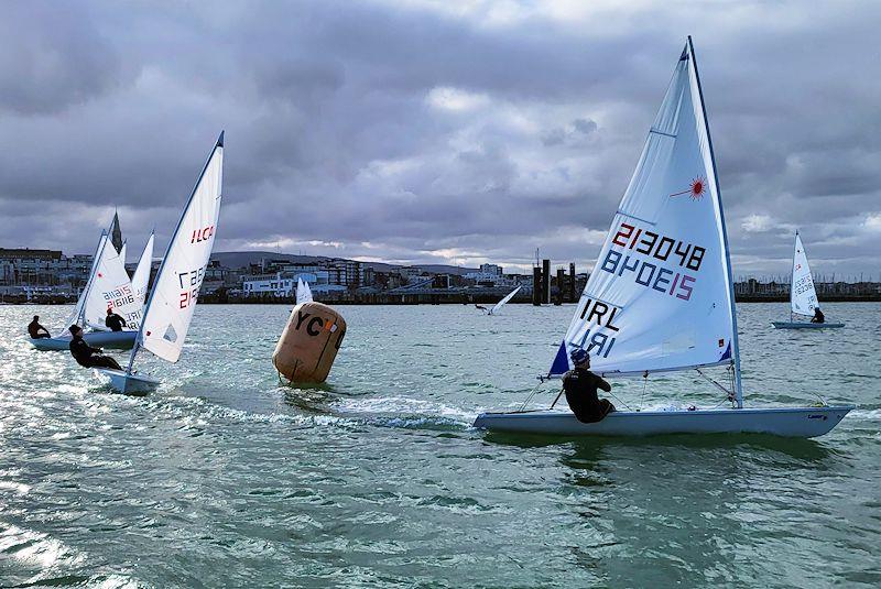 Conor Clancy leads a group of ILCA 6s - Viking Marine DMYC Frostbite Series 2 photo copyright Ian Cutliffe taken at Dun Laoghaire Motor Yacht Club and featuring the ILCA 6 class