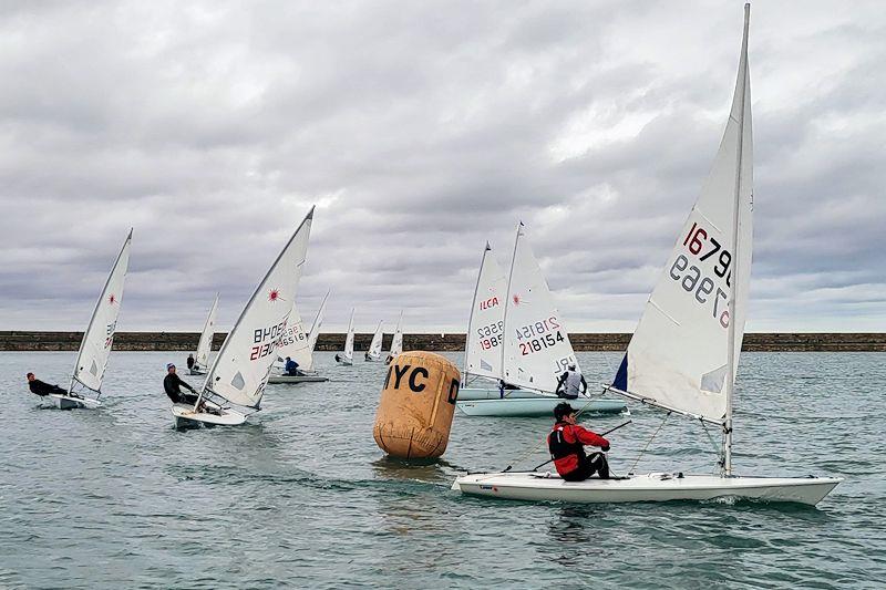 Barry McCartin leads the fleet around the first mark with Conor Clancy coming in on port tack and on the other side of the mark, Sean Craig chases them both - Viking Marine DMYC Frostbite Series 2 day 11 photo copyright Ian Cutliffe taken at Dun Laoghaire Motor Yacht Club and featuring the ILCA 6 class