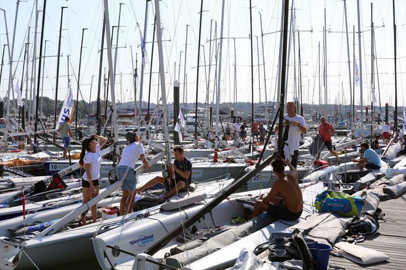 A packed marina waiting for the wind on day 1 of the SB20 Worlds at Cowes  photo copyright Jane Austin taken at Royal Yacht Squadron and featuring the SB20 class