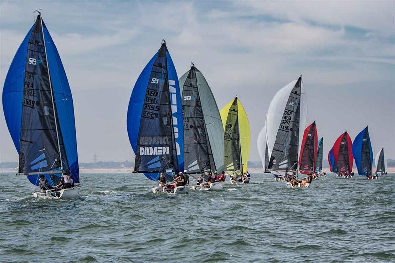 Downwind on day 2 of the SB20 Worlds at Cowes  photo copyright Jennifer Burgis taken at Royal Yacht Squadron and featuring the SB20 class