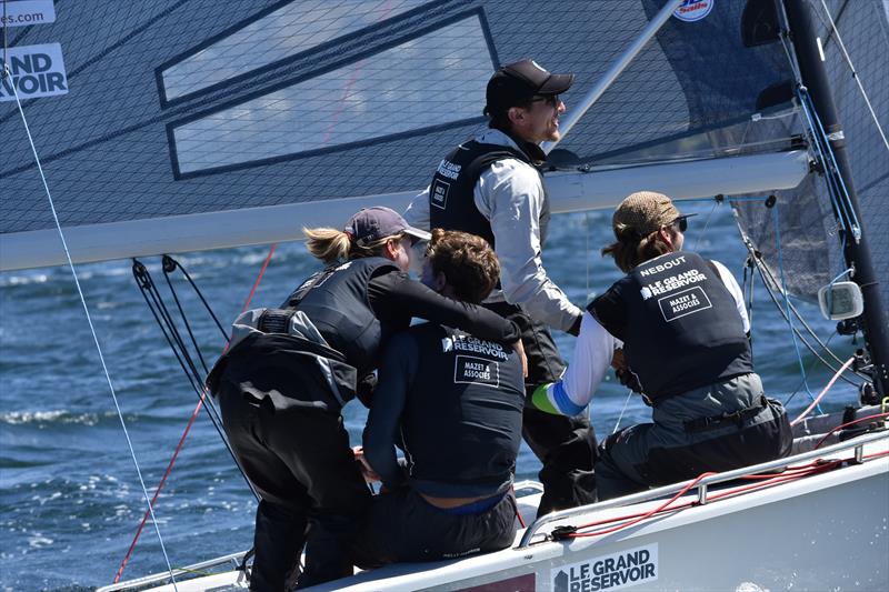 The winning skipper gets a hug from the one girl in the French crew photo copyright Jane Austin taken at Royal Yacht Club of Tasmania and featuring the SB20 class