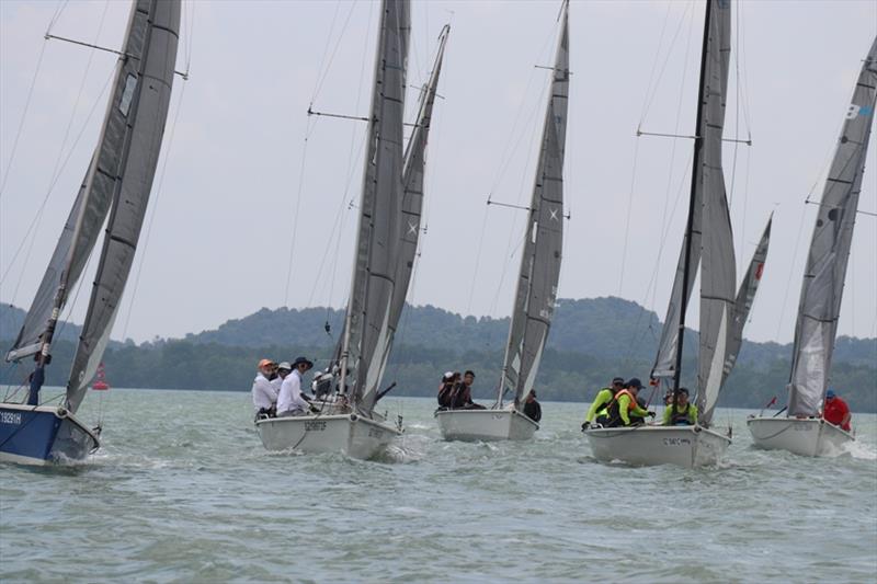 Teams going neck-to-neck as they race to the top mark - SB20 National Championships Singapore photo copyright Raffles Marina taken at  and featuring the SB20 class