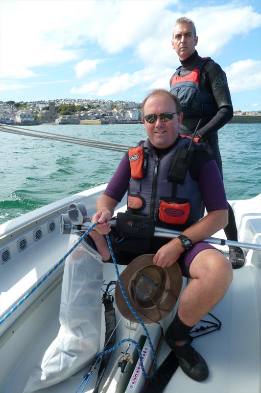 Simon Ashmore controls the jib with Graeme Sennen at the helm of St Ives Sailing Club's dinghy Redemption photo copyright Paul Maskell taken at St Ives Sailing Club and featuring the Laser Stratos class