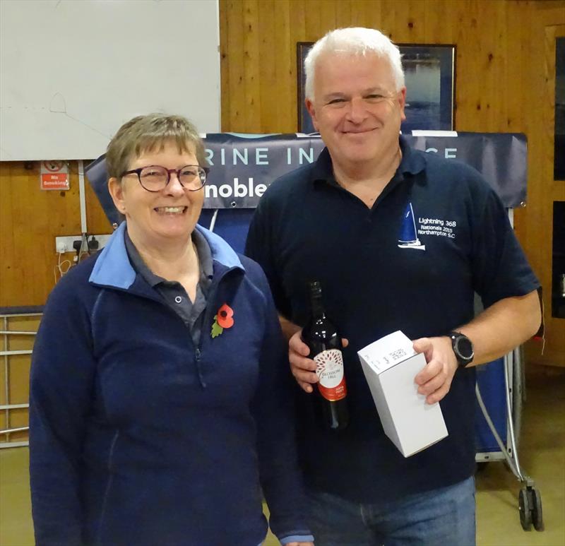 Simon Hopkins seems pleased with his bottle of wine for 3rd overall in the Noble Marine Lightning 368 Open at West Oxfordshire SC photo copyright ?John Butler taken at West Oxfordshire Sailing Club and featuring the Lightning 368 class
