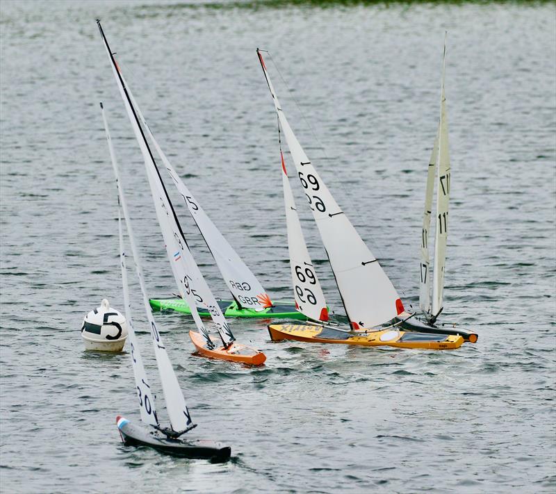 2021 M&S District Marblehead Championship - GAMES 5: Tony 75 rounding the windward mark first with Michael Thomas 69, Rob 89 and Oliver 117 in contention photo copyright Gillian Pearson taken at Guildford Model Yacht Club and featuring the Marblehead class