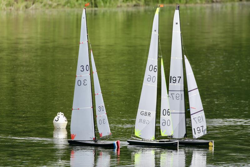 Peter Kirby's conventionally rigged PRIME NUMBER 197 is having a good race with Geoffrey Bremner's F5 06 & Peter Jackson's UP 30 during the Marblehead Mermaid Trophy photo copyright Gillian Pearson taken at Guildford Model Yacht Club and featuring the Marblehead class