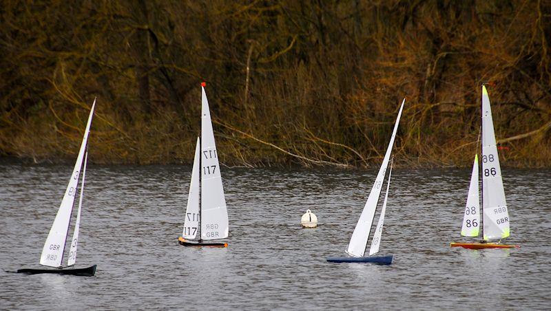 Peter Stollery 39 and Colin Goodman 61 are continuing their match race to windward, whilst Crysell 117 and David Coode 86 are still running some way behind, approaching the gate, - Marblehead Mermaid Trophy at Guildford photo copyright Roger Stollery taken at Guildford Model Yacht Club and featuring the Marblehead class