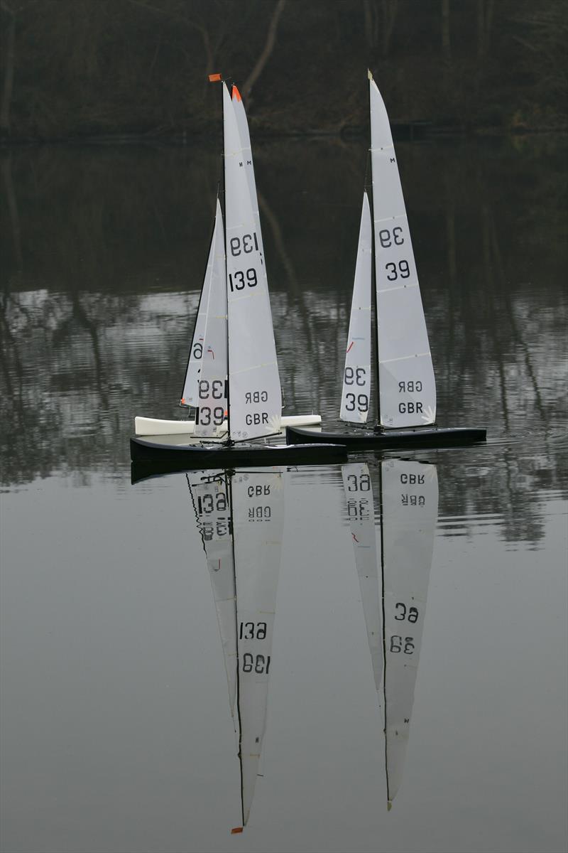 11 year old Oliver Stollery 139 leading his dad 39 as they approached the finish of the practice race during the GAMES 1 Marblehead Open at Chipstead photo copyright Gillian Pearson taken at Chipstead Sailing Club and featuring the Marblehead class