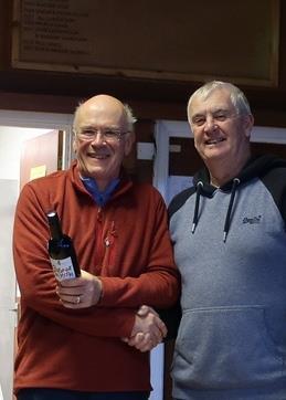 Marblehead GAMES 1 Chipstead - David Allinson presenting first prize to Nigel Barrow, a well known dinghy sailor, just getting to grips with his STARKERS Marblehead photo copyright Stuart Ord-Hume taken at Chipstead Sailing Club and featuring the Marblehead class