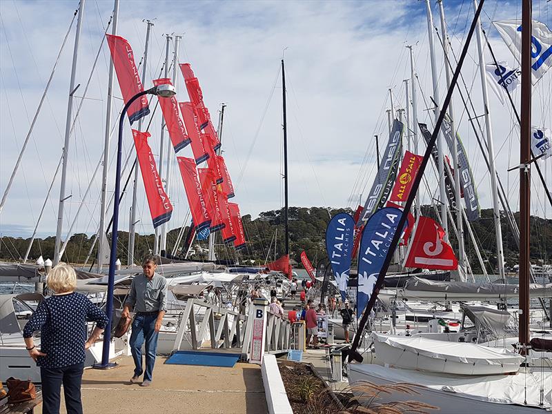The marina came alive with dealer flags aplenty - Club Marine Pittwater Sail Expo 2018 photo copyright Peter Rendle taken at Royal Prince Alfred Yacht Club and featuring the Marine Industry class
