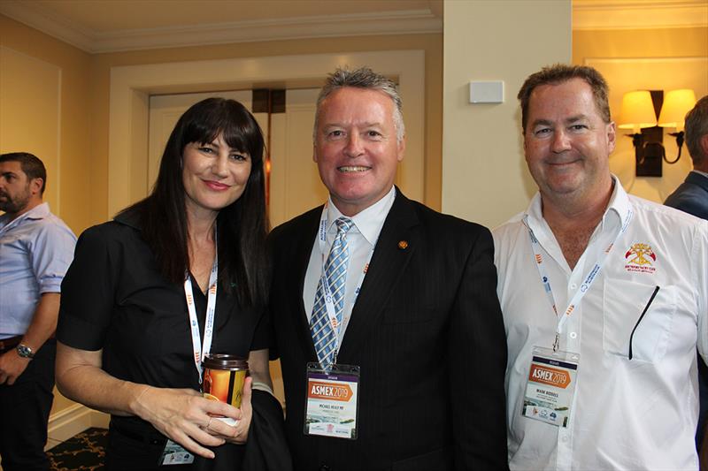 Member for Cairns, Michael Healy with Jo Drake for teh Superyacht Group Great Barrier Reef and Mark Ridell of Suouthport Yacht Club - 2019 Asmex - Day 1 photo copyright Kylie Pike taken at  and featuring the Marine Industry class