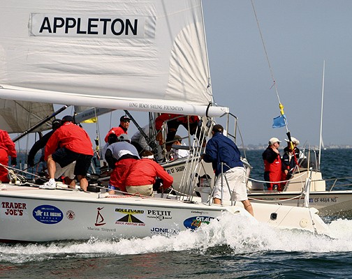 After Brady crashes into Appleton, umpire John Standley (right in red suit) confers with his partner on the incident as Brady (center) follows Appleton around the windward mark at the Congressional Cup photo copyright Rich Roberts taken at Long Beach Yacht Club and featuring the Match Racing class