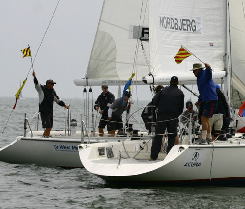 Barker and Denmark's Lars Nordbjerg's tactician Steve Flam wave protest flags on day four at the Congressional Cup photo copyright Rich Roberts taken at Long Beach Yacht Club and featuring the Match Racing class