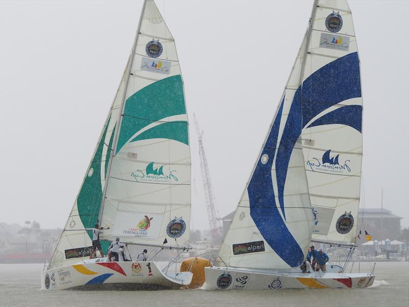 Ishak Jab's RMNMRT/151 Onesails team (left) battling it out with Saiful Bakhtiar Shaarif's SPA/JKR Sailing Team  on day 2 of the Liga Layar Malaysia 2014 Pulau Duyong match racing photo copyright Norzuhaira Ruhanie taken at  and featuring the Match Racing class