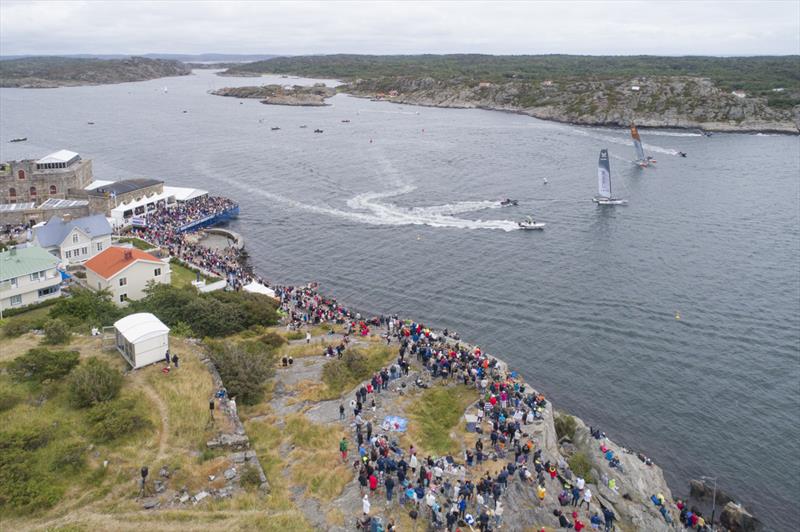 Phil Robertson, China One Ningbo (orange boat), vs Taylor Canfield, US One (grey boat) in the final of the GKSS Match Cup Sweden - photo © Ian Roman / WMRT