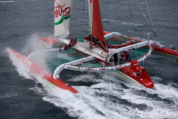 The maxi-trimaran Sodeb’O crossed the start line of the solo round the world record attempt photo copyright Th. Martinez / Sea&Co / www.thmartinez.com taken at  and featuring the Maxi Cat class