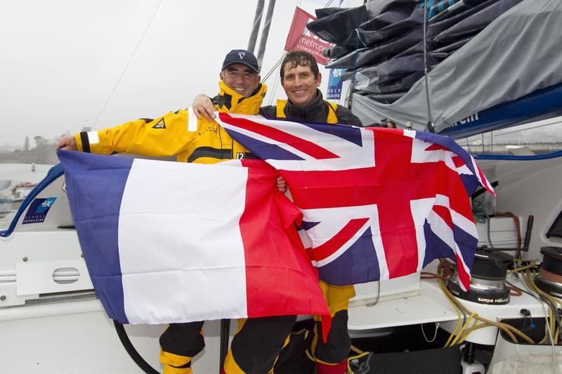 Lock Peyron and Brian Thompson celebrate setting a new Jules Verne Trophy reference time photo copyright Benoit Stichelbaut / BPCE taken at  and featuring the Maxi Cat class