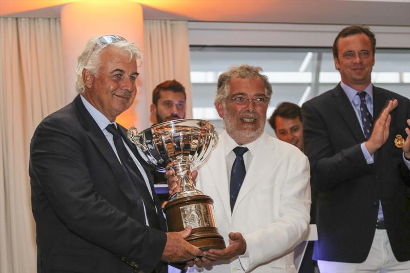 Brad Butterworth, Skipper of Rambler 88 presented with the line honours trophy in the 12th Palermo-Montecarlo race photo copyright Cecilia Conterno taken at Yacht Club de Monaco and featuring the Maxi class