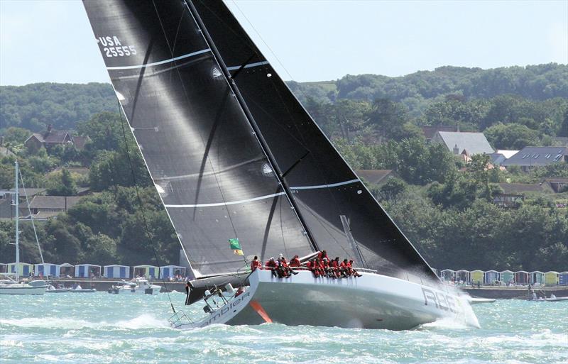 Rambler 88 passes Colwell Bay after the Rolex Fastnet Race start photo copyright Mark Jardine / YachtsandYachting.com taken at Royal Ocean Racing Club and featuring the Maxi class