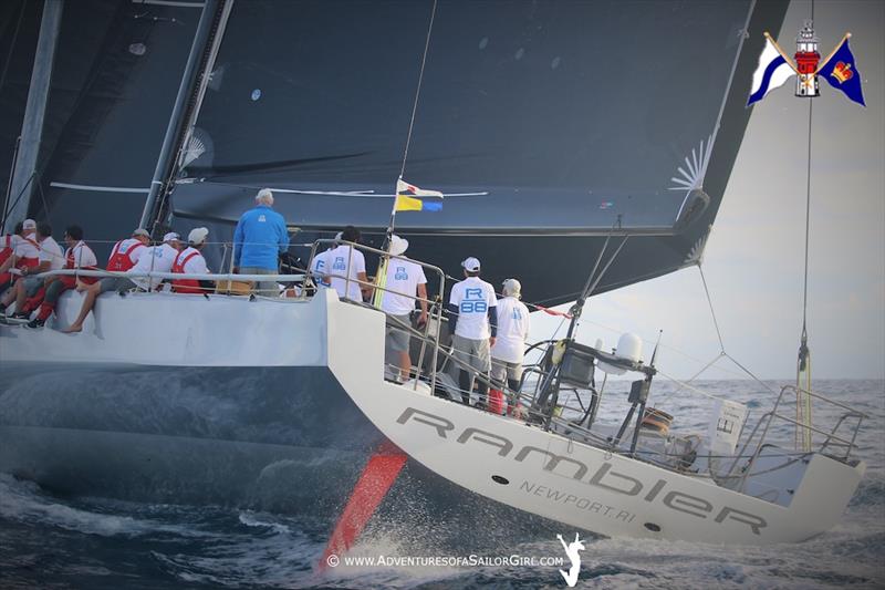 Owner George David (blue jacket) drives Rambler 88 near the end to take line honours in the Newport Bermuda Race photo copyright Nic Douglass / www.AdventuresofaSailorGirl.com taken at Royal Bermuda Yacht Club and featuring the Maxi class