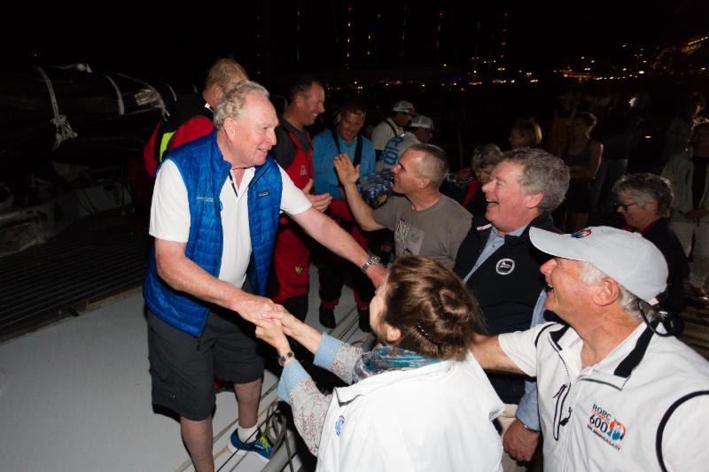 George David and Rambler 88 team is congratulated on the dock in Antigua - photo © RORC / Arthur Daniel