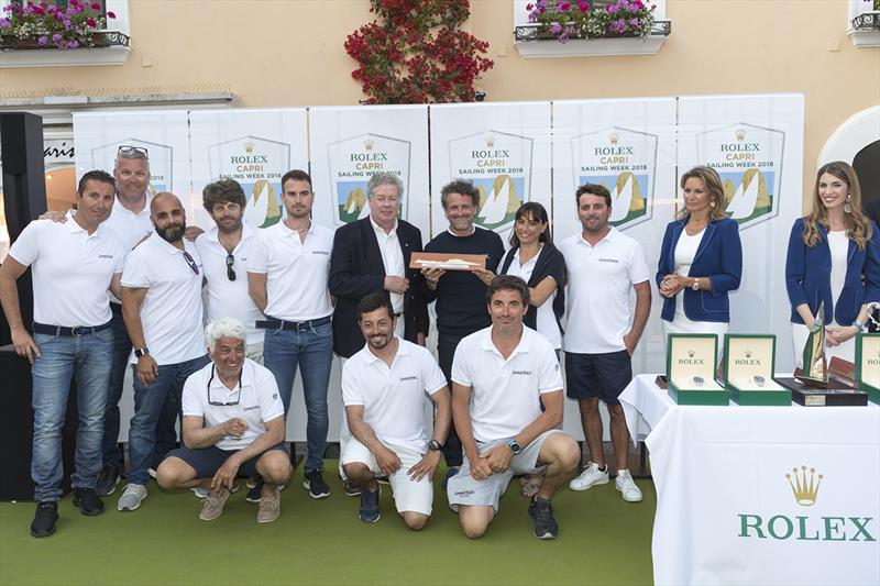 Maxi Racer Cruiser winner Roberto Lacorte is presented with his prize by International Maxi Association Secretary General Andrew McIrvine - Rolex Capri Sailing Week 2018 photo copyright Gianfranco Forza taken at Yacht Club Capri and featuring the Maxi class