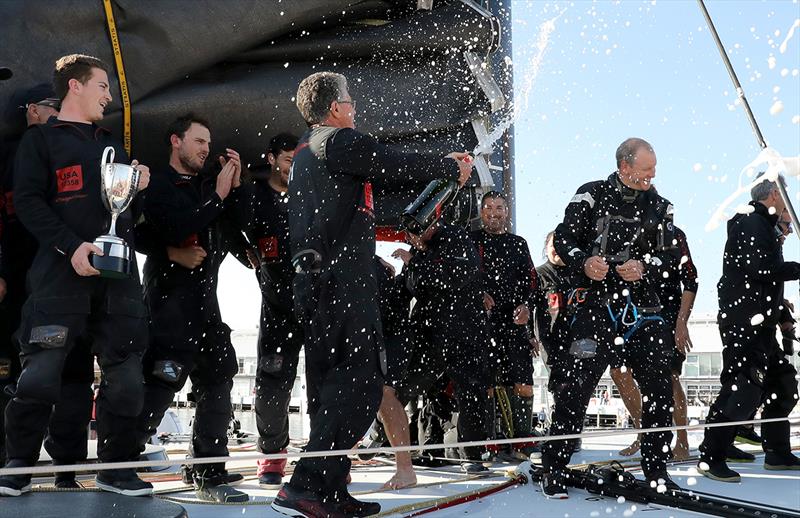 Jim Cooney sprays the crew with Champagne photo copyright Crosbie Lorimer taken at Royal Yacht Club of Tasmania and featuring the Maxi class