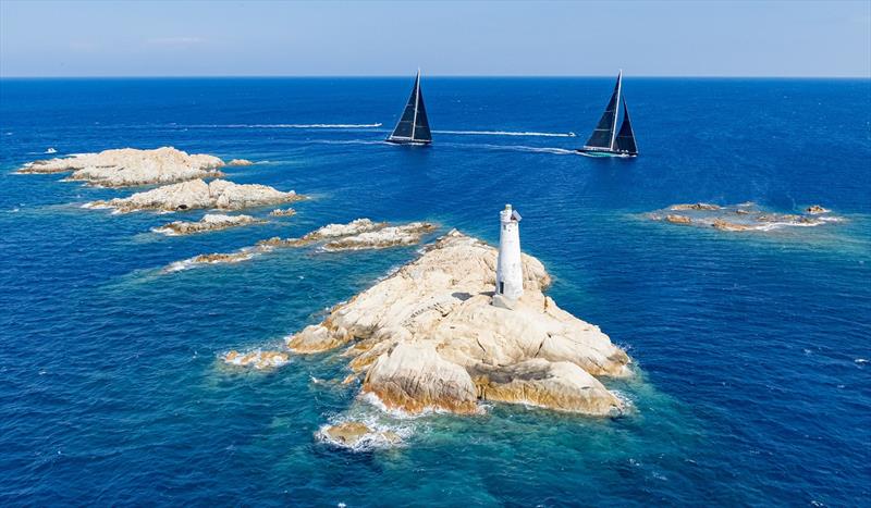 The Monaci lighthouse and rocks form one the most famous course marks at the Maxi Yacht Rolex Cup photo copyright Carlo Borlenghi taken at Yacht Club Costa Smeralda and featuring the Maxi class