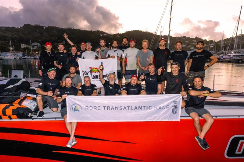 Comanche crew celebrate setting a new race record in the 2022 RORC Transatlantic Race after completing the race to Grenada in record time: 7d 22hrs 1min 4secs photo copyright Arthur Daniel / RORC taken at Royal Ocean Racing Club and featuring the Maxi class