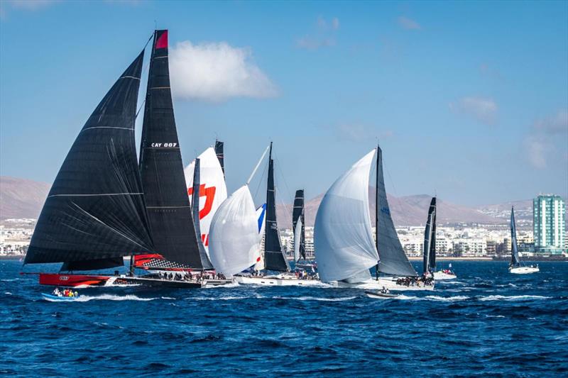 The mighty Comanche leads the fleet at the start of the RORC Transatlantic Race off Arrecife's Marina Lanzarote, Canary Islands photo copyright Lanzarote Photo Sport taken at Royal Ocean Racing Club and featuring the Maxi class