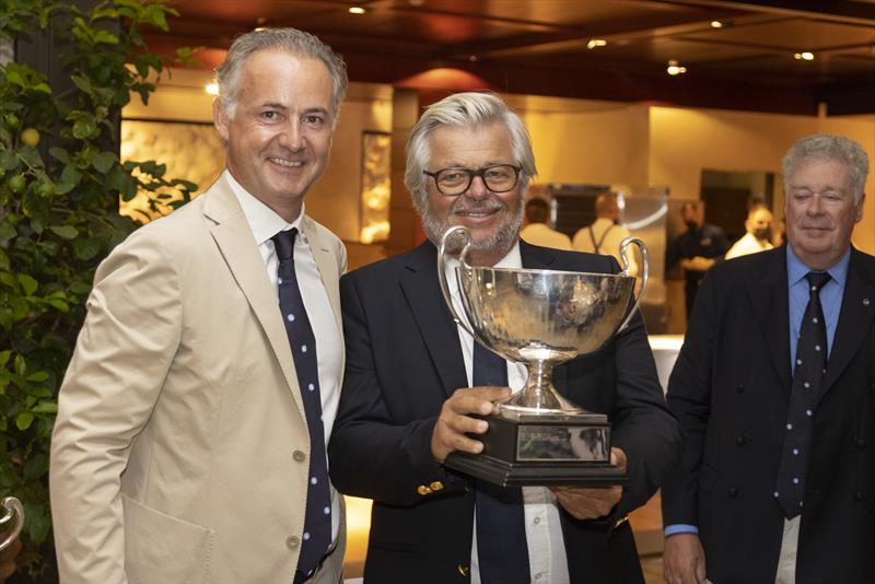 Spirit of Lorina owner Jean-Pierre Barjon with the 2021-22 IMA Mediterranean Maxi Offshore Challenge winner's trophy photo copyright IMA / Studio Borlenghi taken at Yacht Club Costa Smeralda and featuring the Maxi class