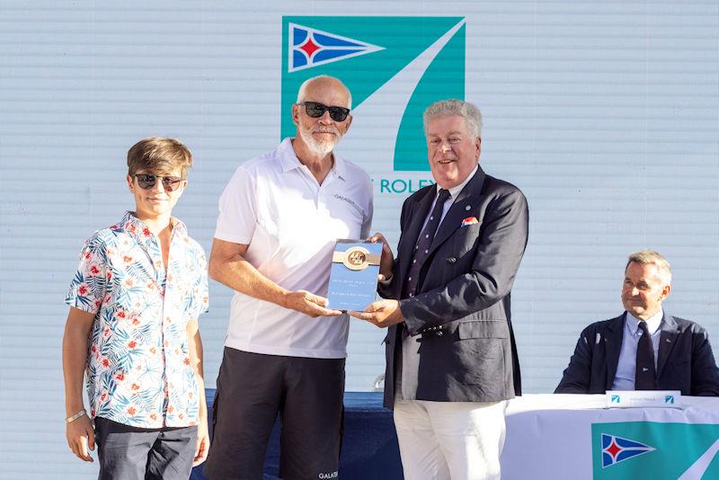 David M. Leuschen collects the trophy for the best placed IMA member from Secretary General Andrew McIrvine at the Maxi Yacht Rolex Cup 2022 - photo © IMA / Studio Borlenghi