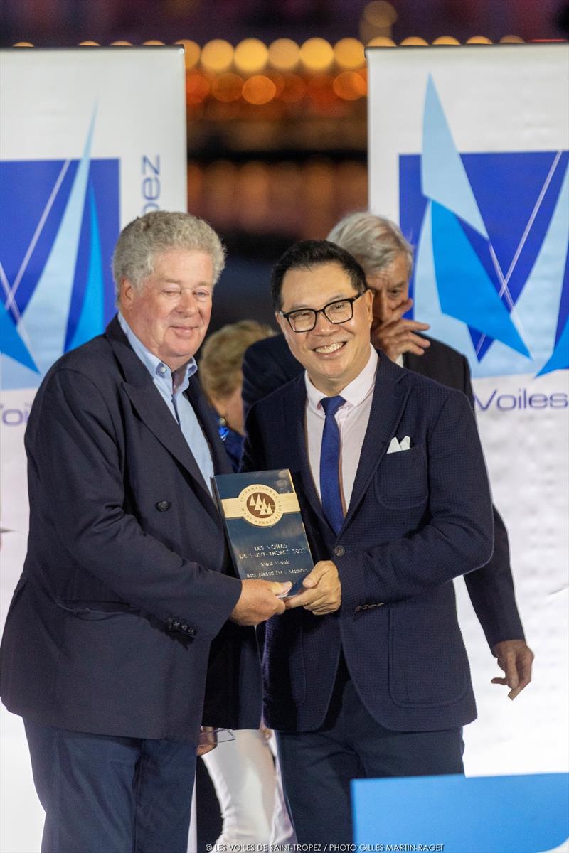 Lyra's Terry Hui receives the IMA member's prize from Secretary General Andrew McIrvine. - IMA Mediterranean Maxi Inshore Challenge - Les Voiles de Saint-Tropez photo copyright Gilles Martin-Raget taken at Société Nautique de Saint-Tropez and featuring the Maxi class