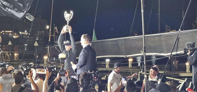 John Winning Jnr hoists the Illingworth trophy aloft for Line Honours, 2022 Sydney to Hobart race photo copyright Clayton Reading taken at Cruising Yacht Club of Australia and featuring the Maxi class
