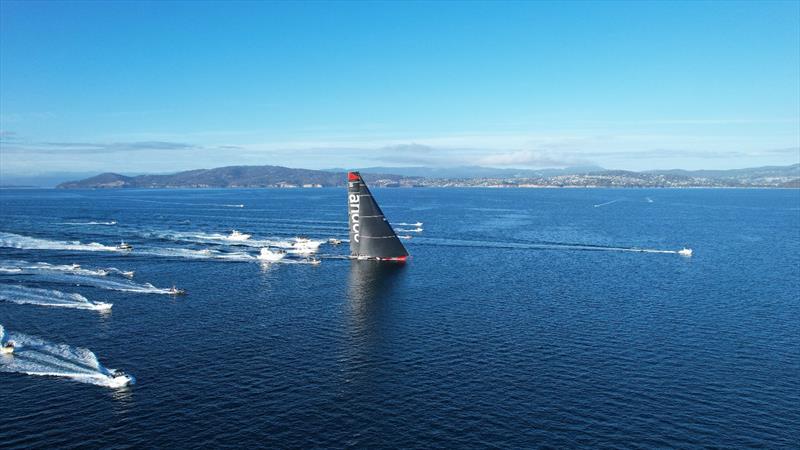 andoo Comanche and the spectator fleet photo copyright Tony Lathouras taken at Royal Yacht Club of Tasmania and featuring the Maxi class