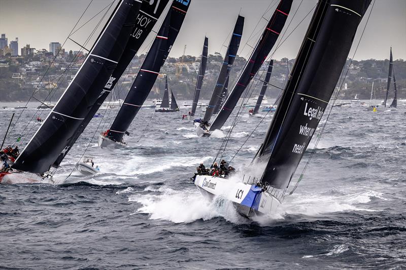 Charge! LawConnect leads the maxis and the remainder of the fleet out of the Heads after the start of the 2025 Rolex Sydney Hobart Yacht Race photo copyright Kurt Arrigo / Rolex taken at Cruising Yacht Club of Australia and featuring the Maxi class